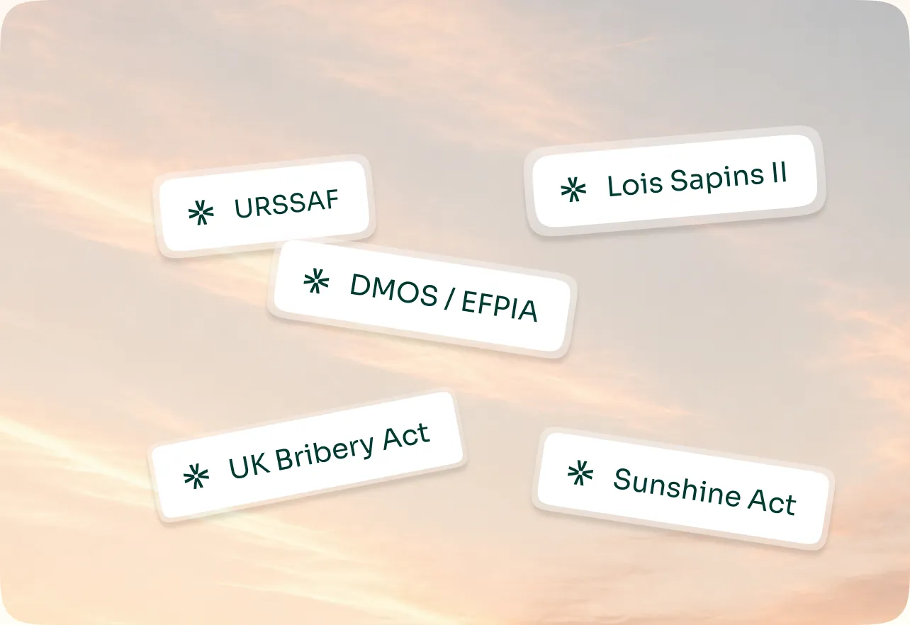 Étiquettes des régimes applicables (Sapin II, URSSAF, DMOS/EFPIA, UK Bribery Act, Sunshine Act) posées sur un ciel
